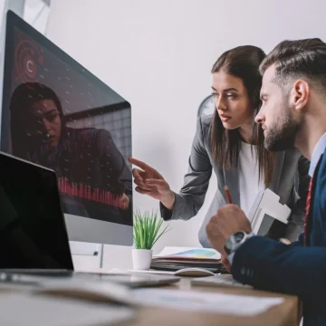 selective-focus-of-information-security-analysts-using-charts-on-computer-monitors-while-working-in-1536x1025